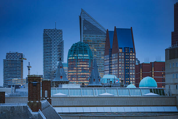 skyline with the modern office buildings in the centre of The Hague  at dusk; The Hague, Netherlands