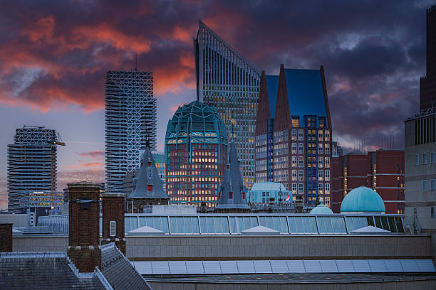 skyline with the modern office buildings in the centre of The Hague  at dusk; The Hague, Netherlands
