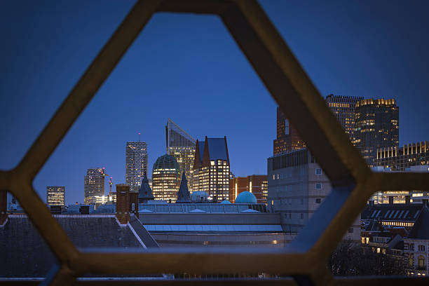 skyline with the modern office buildings in the centre of The Hague  at dusk; The Hague, Netherlands