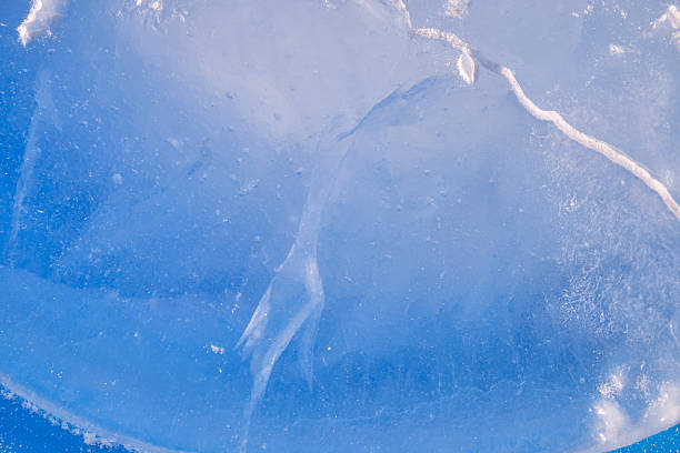 Texture of winter ice surface. Blue natural ice background.