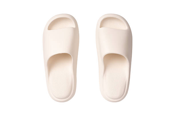 istock Minimalist white sandals isolated on a white background. Ideal for concepts related to summer fashion, travel, relaxation, minimalist style, and e-commerce product. 2248340874