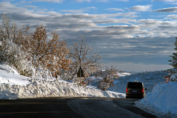 view of a mountain road with snow