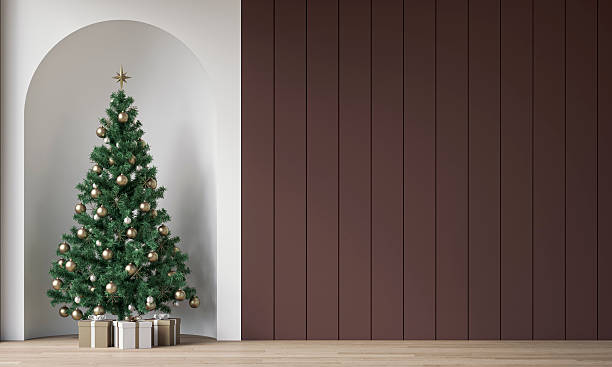 istock Modern minimalist unfurnished interior decorated for Christmas, with an accent empty chocolate brown shiplap wall and copy space, Christmas tree with presents in a wall niche, near a window 2248342814