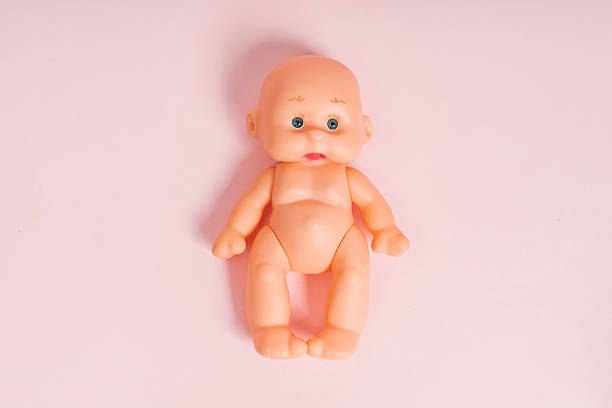 Baby Doll isolated on pink background