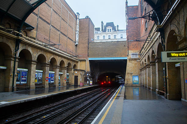 A Subway train arriving at Paddington subway station platform in London, England