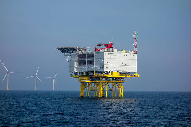 istock Offshore Wind Farm and Energy Platform in Open Sea. Renewable Energy Infrastructure and Sustainable Power Generation Concept for Environmental and Industrial Use 2248348312