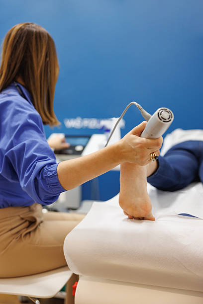 istock Physiatrist examining patient's Achilles tendon with ultrasound on examination table 2248348568