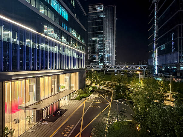 istock City office buildings decorated with neon lights at night 2248349833