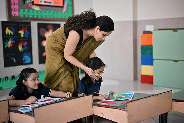 istock Teacher Encouraging Students During Classroom Art Activity 2248350334