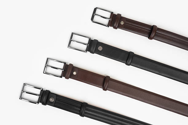 istock Leather Belts in Row on White Background 2248350613