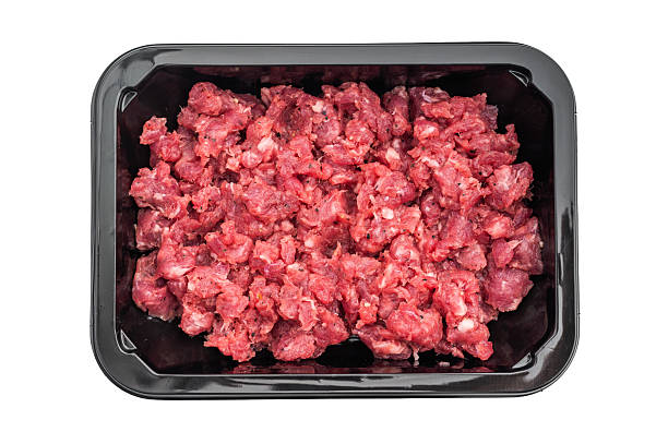 istock Fresh raw minced beef in a black plastic tray on a clean white background ideal for butcher retail grocery and food stock photography. 2248352743