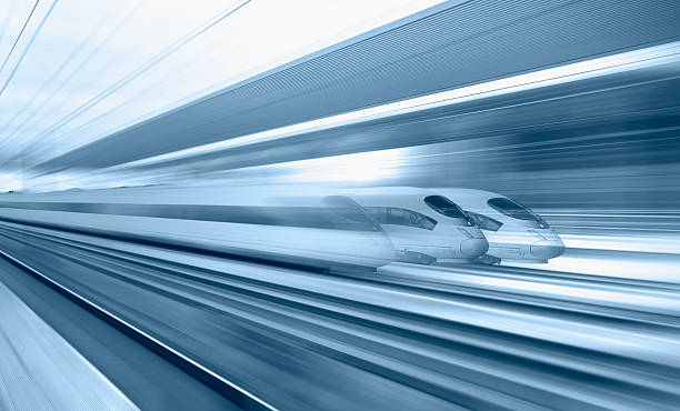 istock Blue high speed train runs on rail tracks - The train is going too fast as a result the air pressure is causing too much heat at the front 2248354408