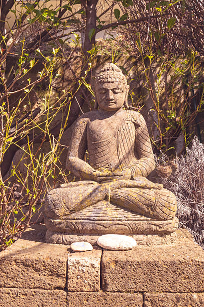 Close-up of a statue of Buddha. Vertical.