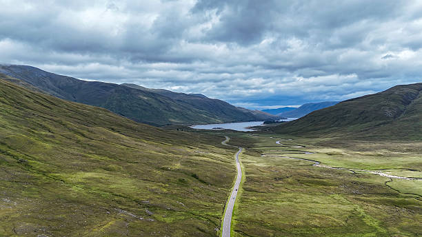 View on the road from  Loch Cluanie to loch Duich , in Scotland, United Kingdom. Under a dramatic sky. Drone shot.