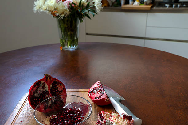 Fresh cut pomegranate on kitchen table