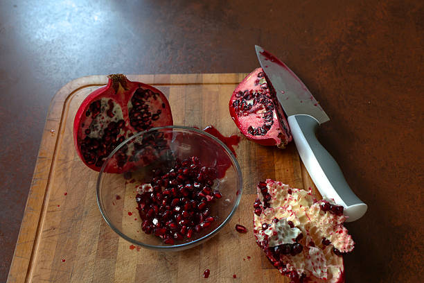 Fresh cut pomegranate on kitchen table