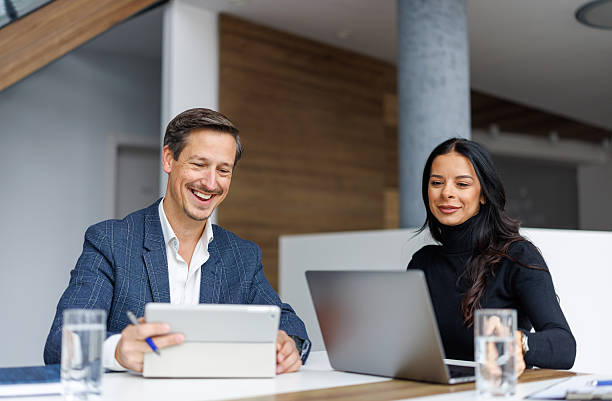 istock Business colleagues collaborating on digital devices in office 2248358102