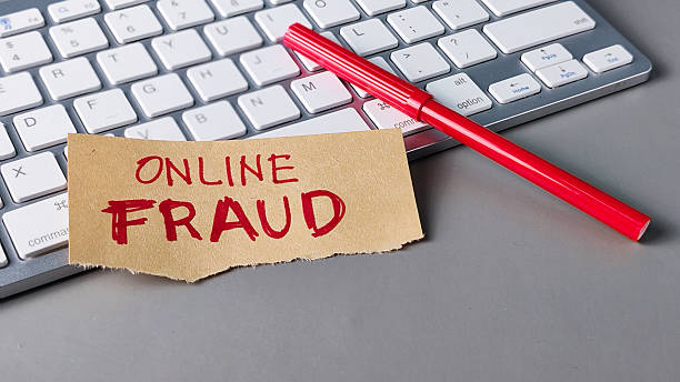 istock Online Fraud Warning Note on Keyboard: Cybercrime, Internet Security, and Digital Scam Concept 2248358580