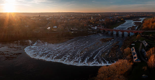 Evening view of Venta Rapid and red brick bridge in Kuldiga Latvia
