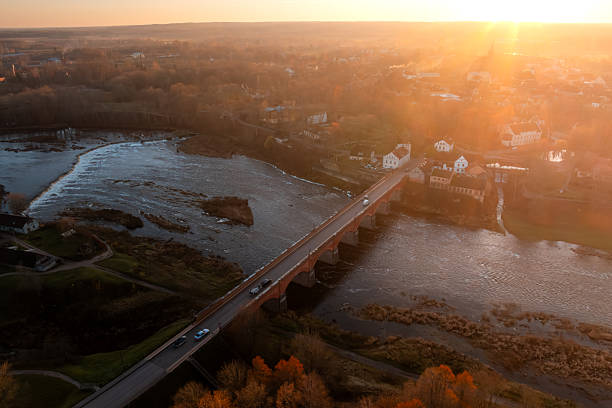 Kuldiga Latvia, Ventas Rumba and old brick bridge at sunset