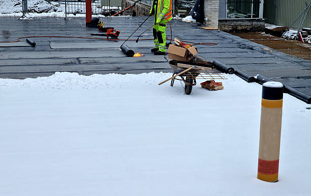 istock Bitumen roll roofing,  rolled asphalt, is a waterproof, flexible,  for flat or low-sloped roofs. utilitarian structures like shed, garage, and commercial buildings due to its ease of installation and durability in low-pitch scenarios 2248359502