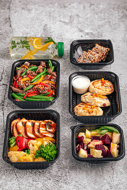 istock Fitness meal plan in black containers with drink 2248359671