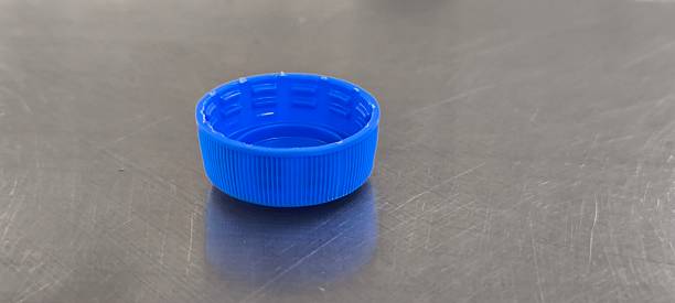 istock A blue soda bottle cap sits on a stainless steel table. 2248363151