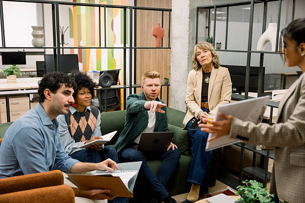 istock Diverse business team collaborating during meeting in modern office 2248364012