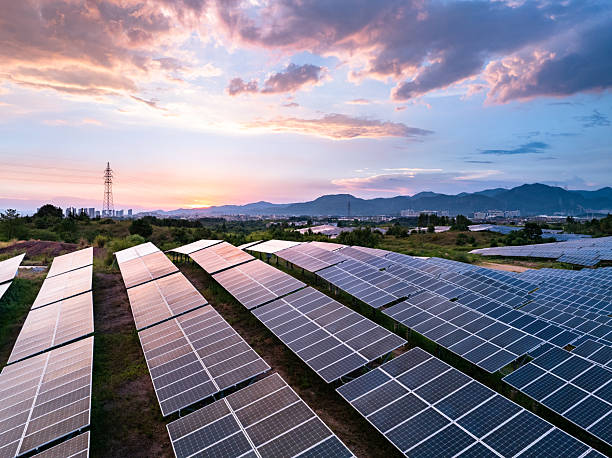 istock aerial view Solar farm glows at sunset 2248365394