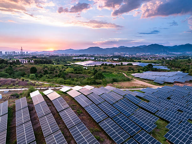istock aerial view Solar farm glows at sunset 2248365504