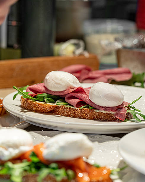 istock Bruschetta with pastrami, arugula and poached eggs 2248365940