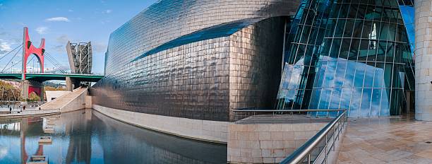 Bilbao, Spain - 15 March 2024: A general view of Bilbao by the Nervion river, with the Guggenheim museum building, designed by Frank Gehry