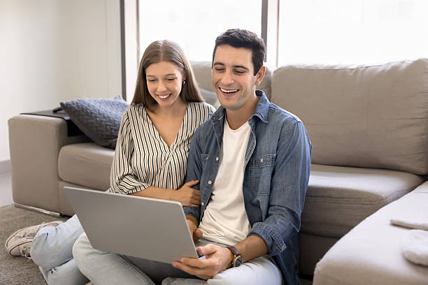 istock Happy Latin couple spend time on internet using laptop 2248368496
