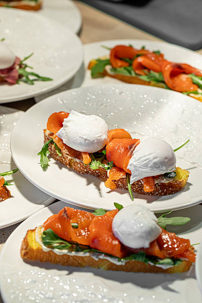 istock Bruschetta with salmon and poached eggs on white plate 2248368651