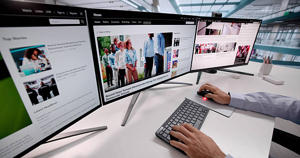 istock Man Reading Online News Website With Articles On Computer Screen 2248369924