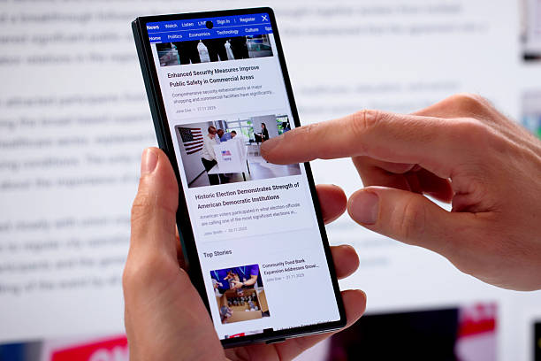 istock Man Reading Online News Articles On Mobile Phone 2248369945