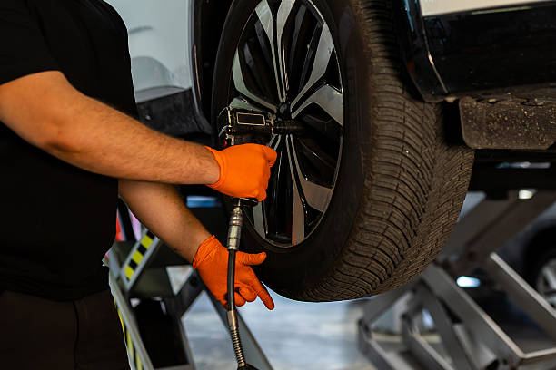istock Professional tire workshop wheel bolt tightening 2248377211