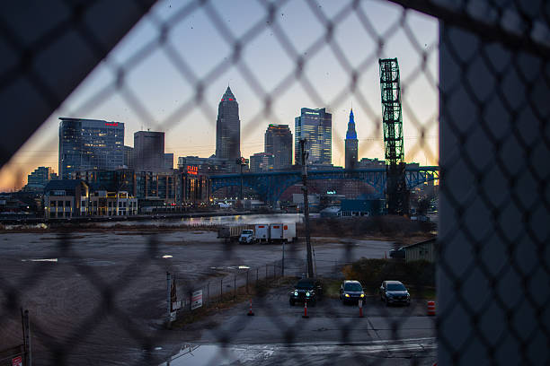 View of Downtown Cleveland Skyline at Dawn from Wendy Park Bridge, near Edgewater Park and Whiskey Island, and located above the Norfolk Southern Railroad crossing. Visible in frame are buildings like Key Tower, 200 Public Square, Sherwin Williams Headquarters, and Terminal Tower, among others