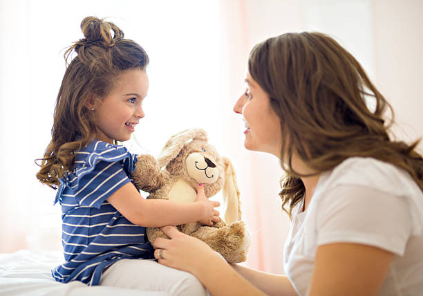 istock Mother and daughter enjoy in bed at home 2248379155