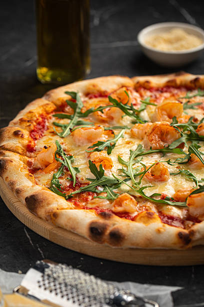 istock Shrimp and arugula pizza with cheese and sauce 2248380349