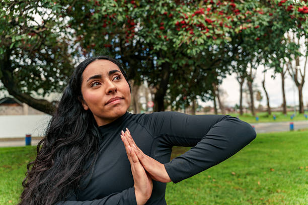istock Woman practicing yoga outdoors finding balance and wellness 2248380778