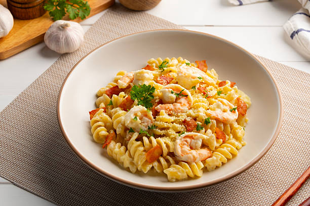 istock Pasta carbonara with shrimp in white plate. 2248380920
