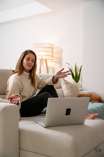 istock Woman explaining during video call using laptop at home 2248381512