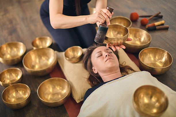 istock Relaxation with singing bowls therapy in calm setting 2248383268