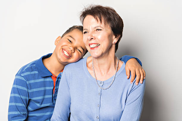 A Boy with grandmother in studio white background