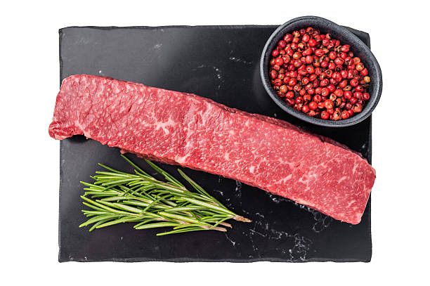 istock Premium Japanese wagyu beef steak, highlighting its tender texture and luxurious fat content. Ideal for those seeking a truly indulgent culinary experience. isolated on white background. top view 2248387299