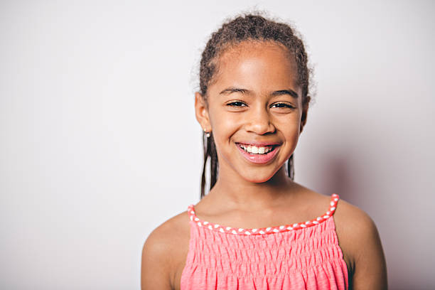 istock Cute nine years old child with pink dress on studio white background 2248391651