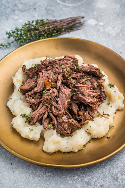 istock Homemade French Beef Bourguignon Stew on a plate with mashed potatoes. grey background. top view 2248392408
