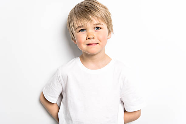 istock A cute five year old boy studio portrait on white background 2248395433