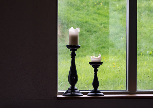 vintage and old candlestick on windowsill